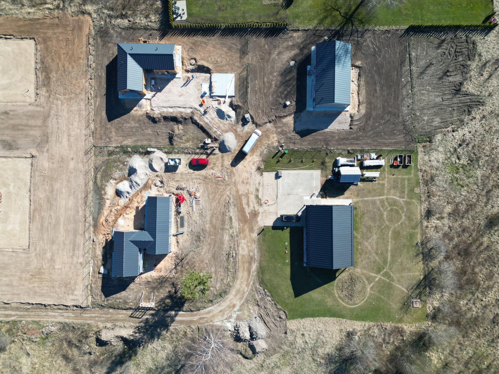 Aerial view of timber homes at different stages of construction